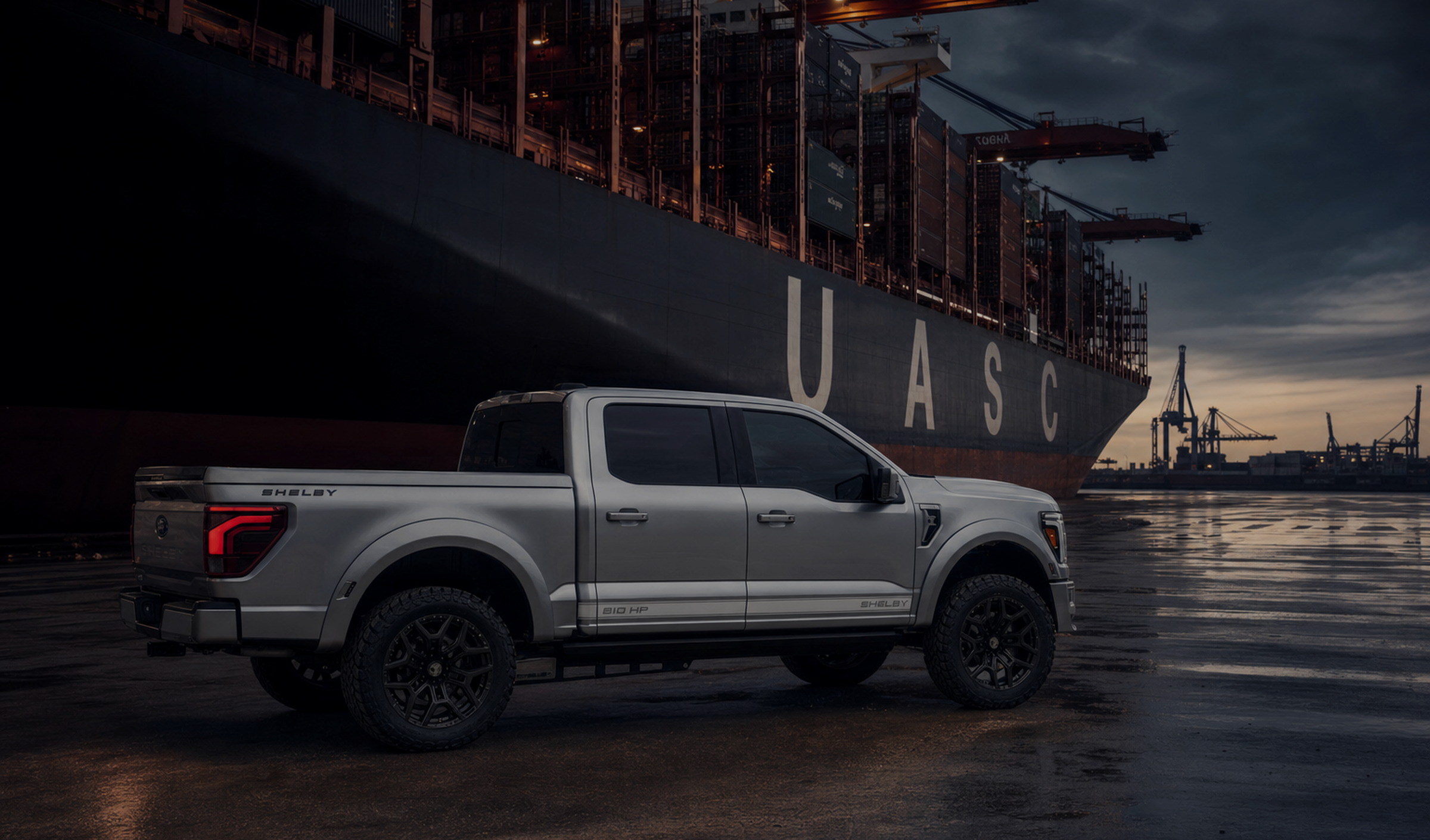 Brand artwork with a silver Shelby truck in a commercial port setting