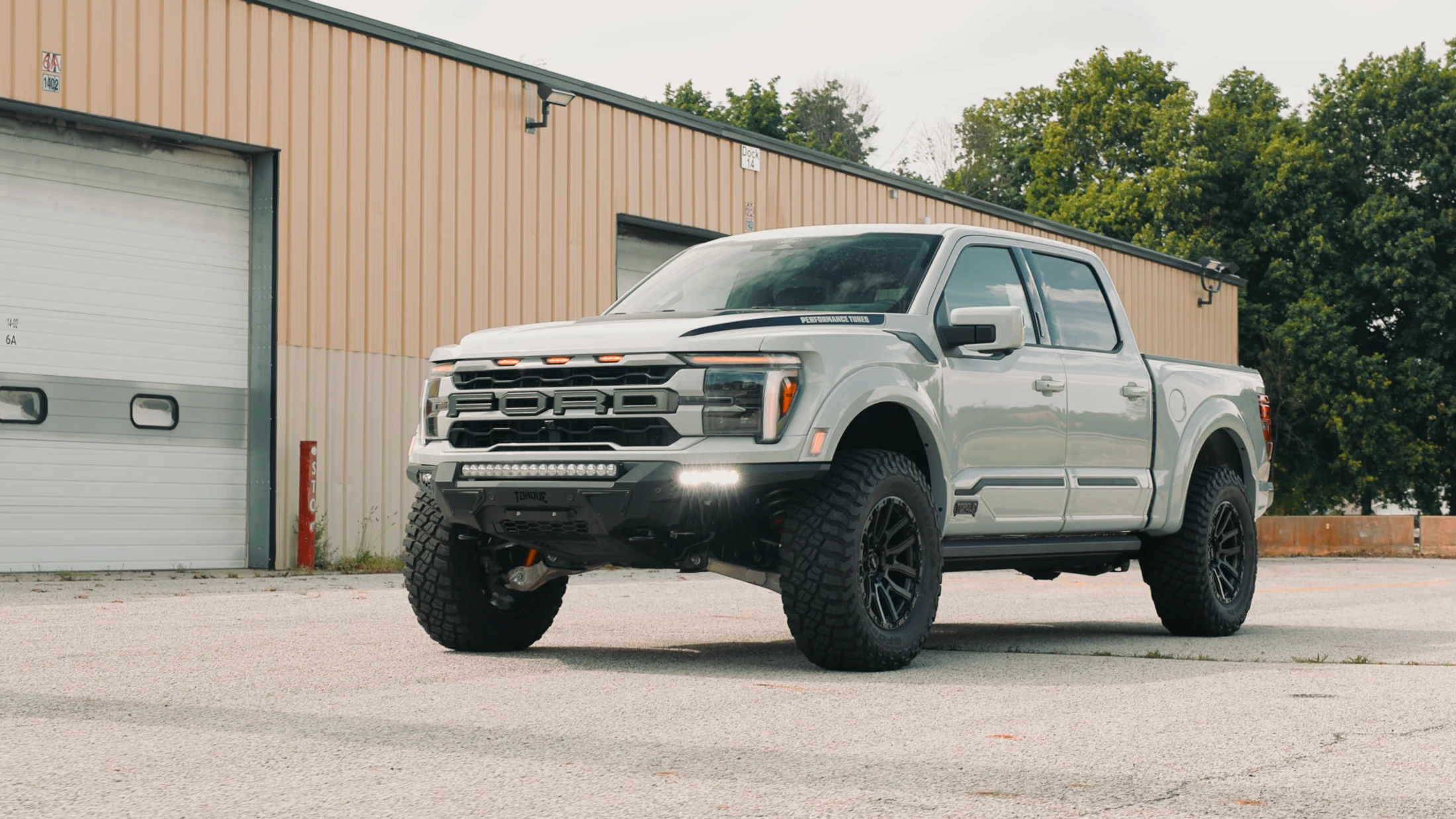 White 2026 Torque 670 Raptor in a facility exterior setting